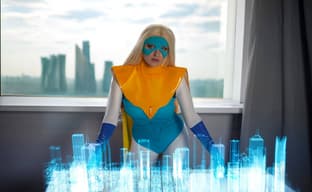 Superheroine in Action: Model Shows Off Blondie Blazer Cosplay from Dispatch
